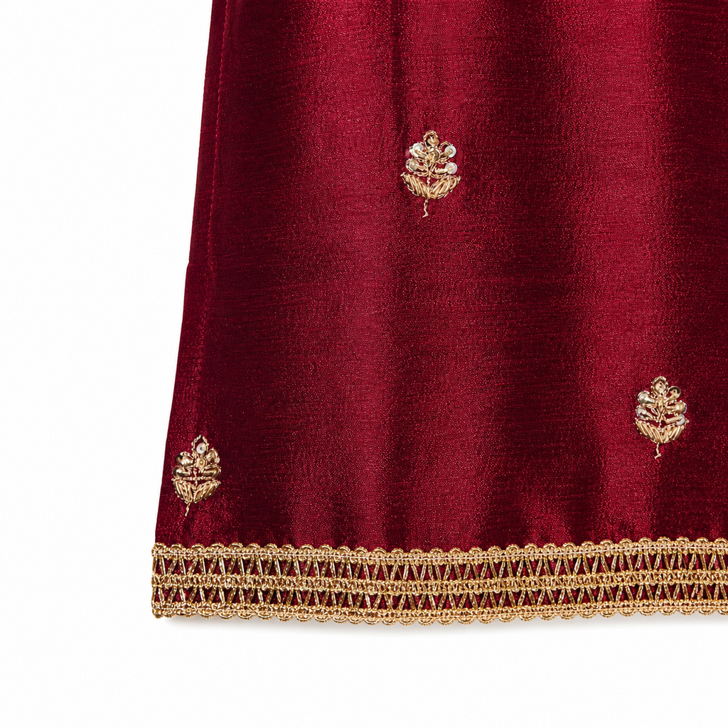 Maroon fabric with gold embroidery on a white background