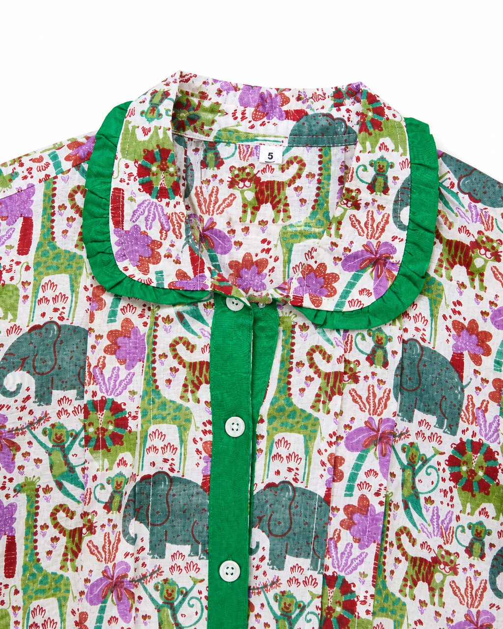Children's shirt with colorful animal pattern and green collar on a white background