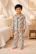 Child wearing a patterned pajama set in a bedroom