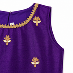 Purple top with gold embroidery on a white background