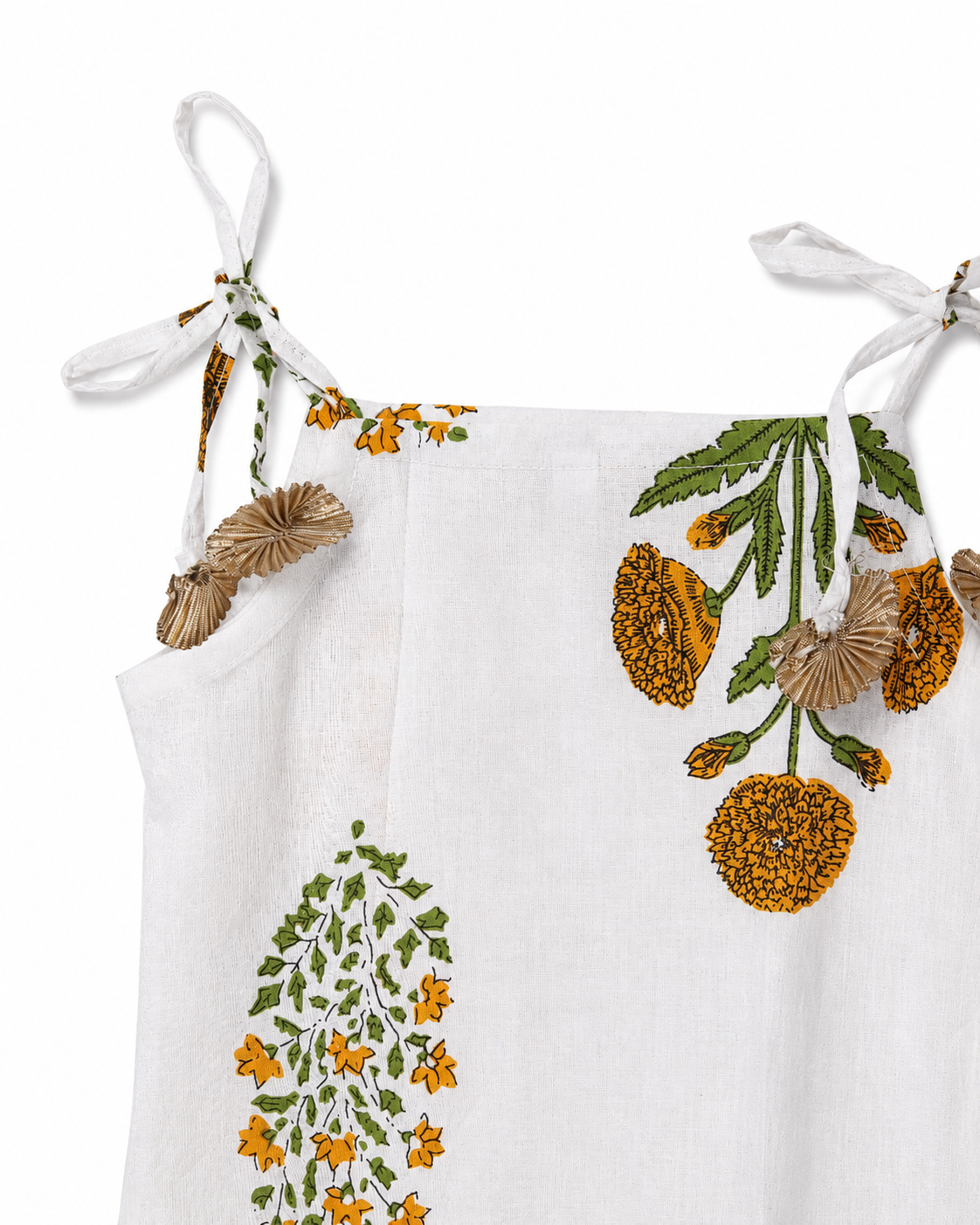 White top with floral embroidery on a white background