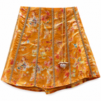 Floral skirt with gold chain details on a white background