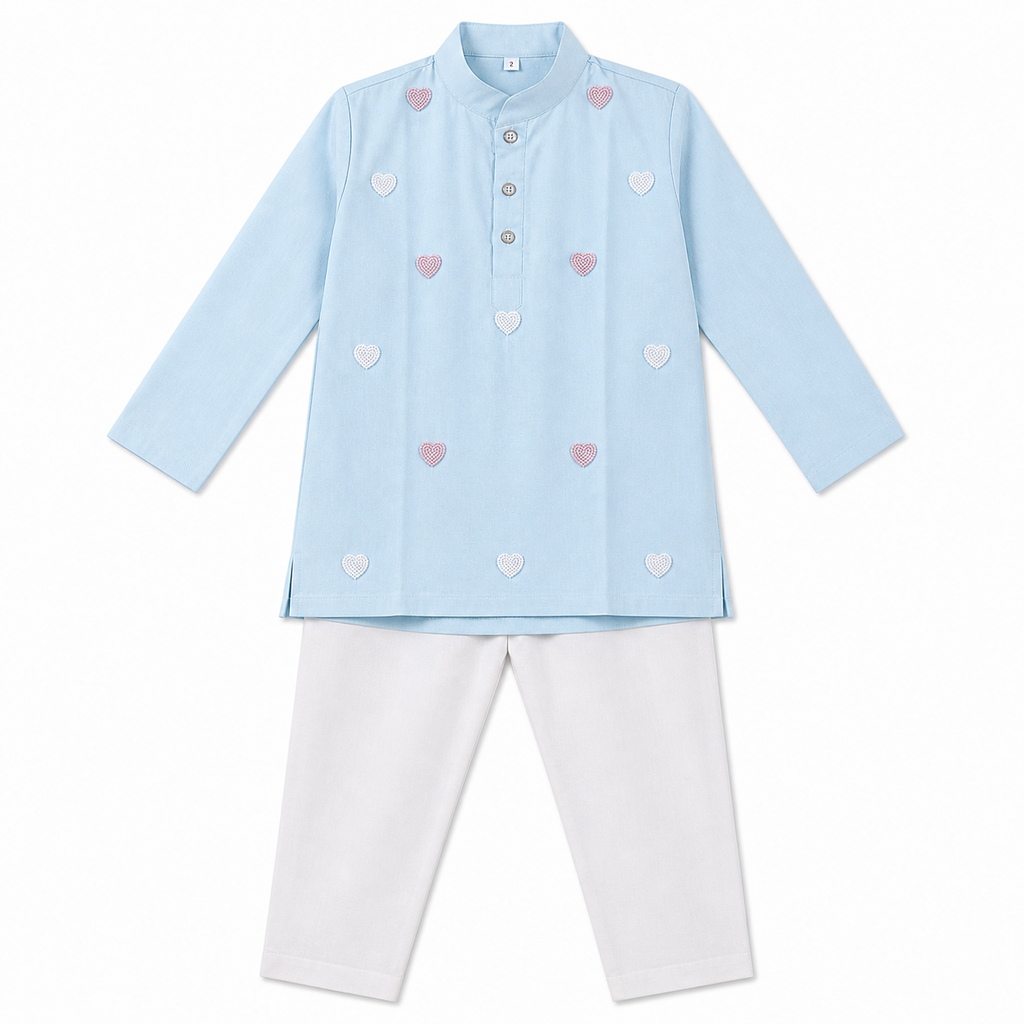 Light blue shirt with heart patterns and white pants on a white background