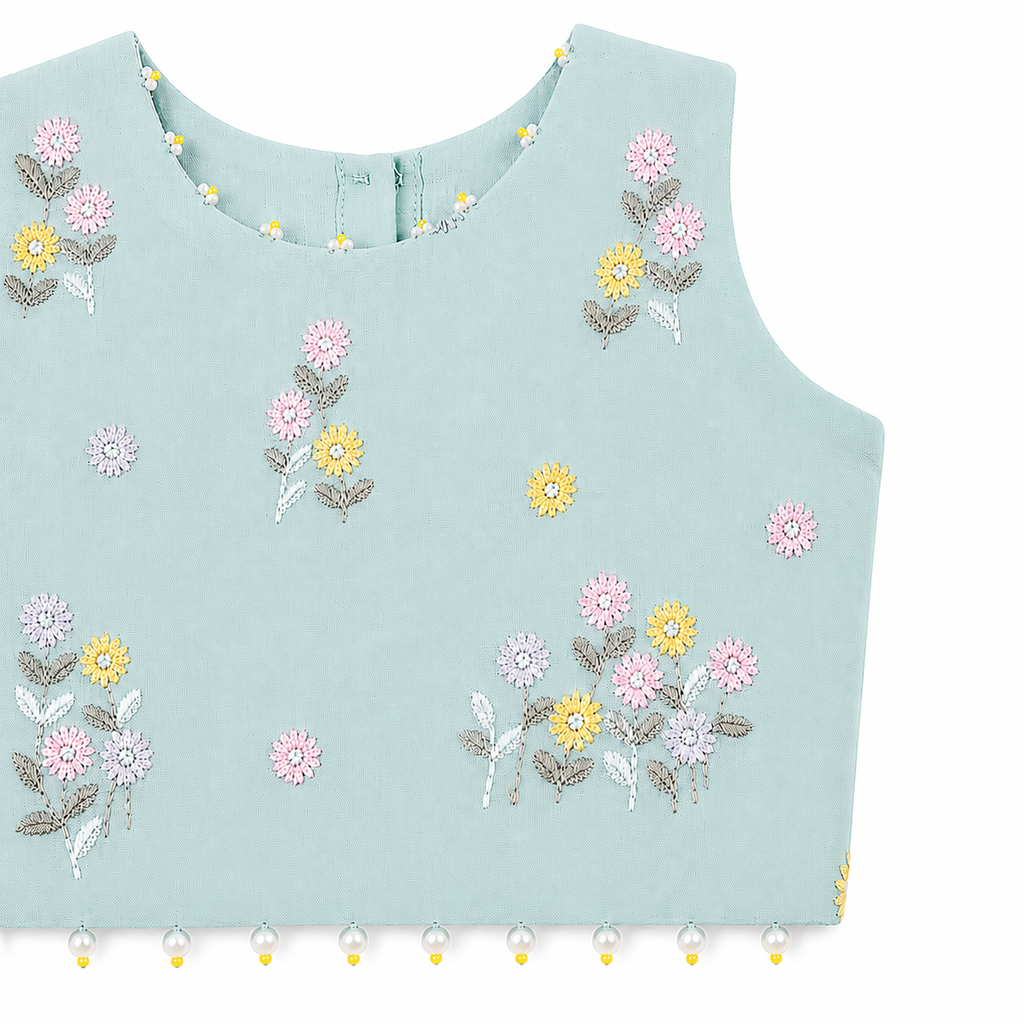 Light blue sleeveless top with floral embroidery on a white background