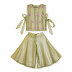 Green outfit with pink floral embroidery on a white background