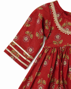 Red floral dress with gold accents on a white background