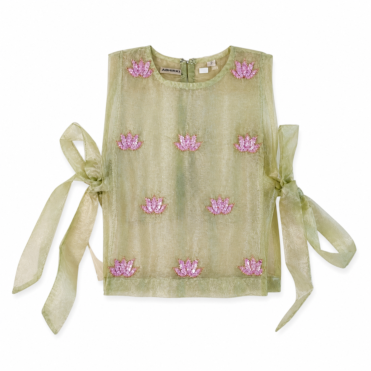 Green top with pink floral embellishments and sheer sleeves on a white background