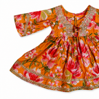 Floral dress with orange and pink flowers on a white background