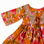 Vibrant floral dress with gold trim