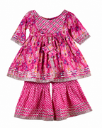 Pink children's dress with floral pattern on a white background