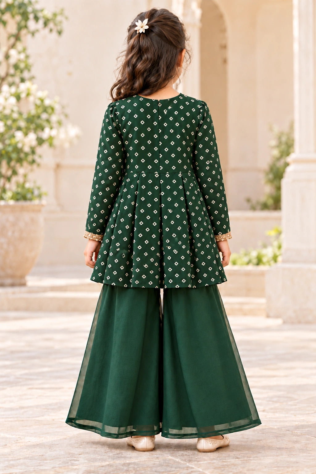 Back view of the printed bottle green peplum top and plain organza palazzo trousers