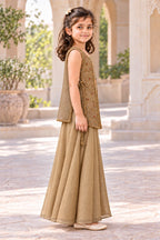 Side view of the sleeveless embroidered jacket, plain rear layer and wide-flared gold palazzos