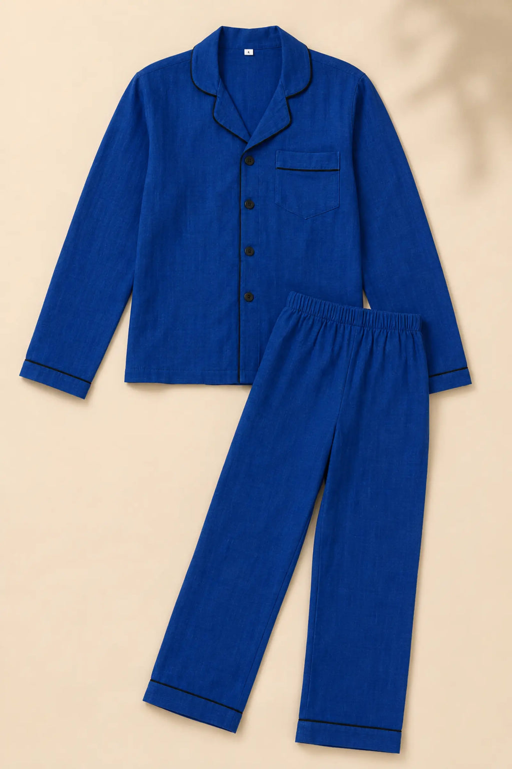 Close-up of piping and buttons on dark blue night suit
