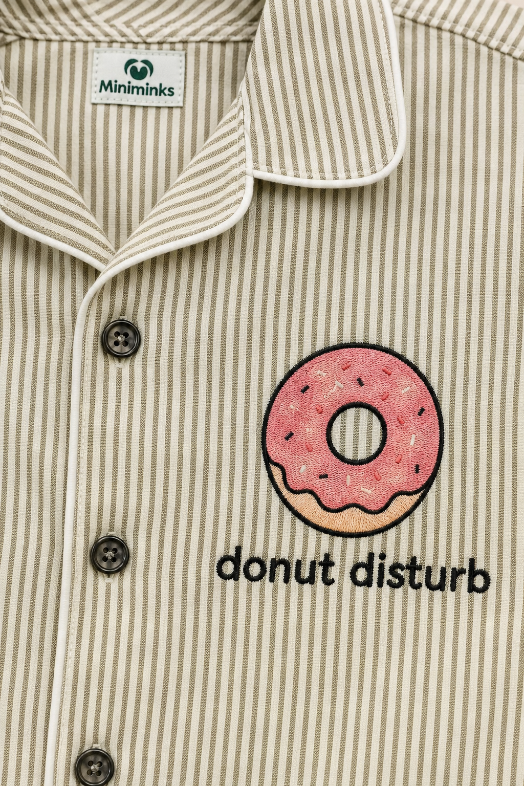 Close-up of donut motif and contrast piping on striped night suit