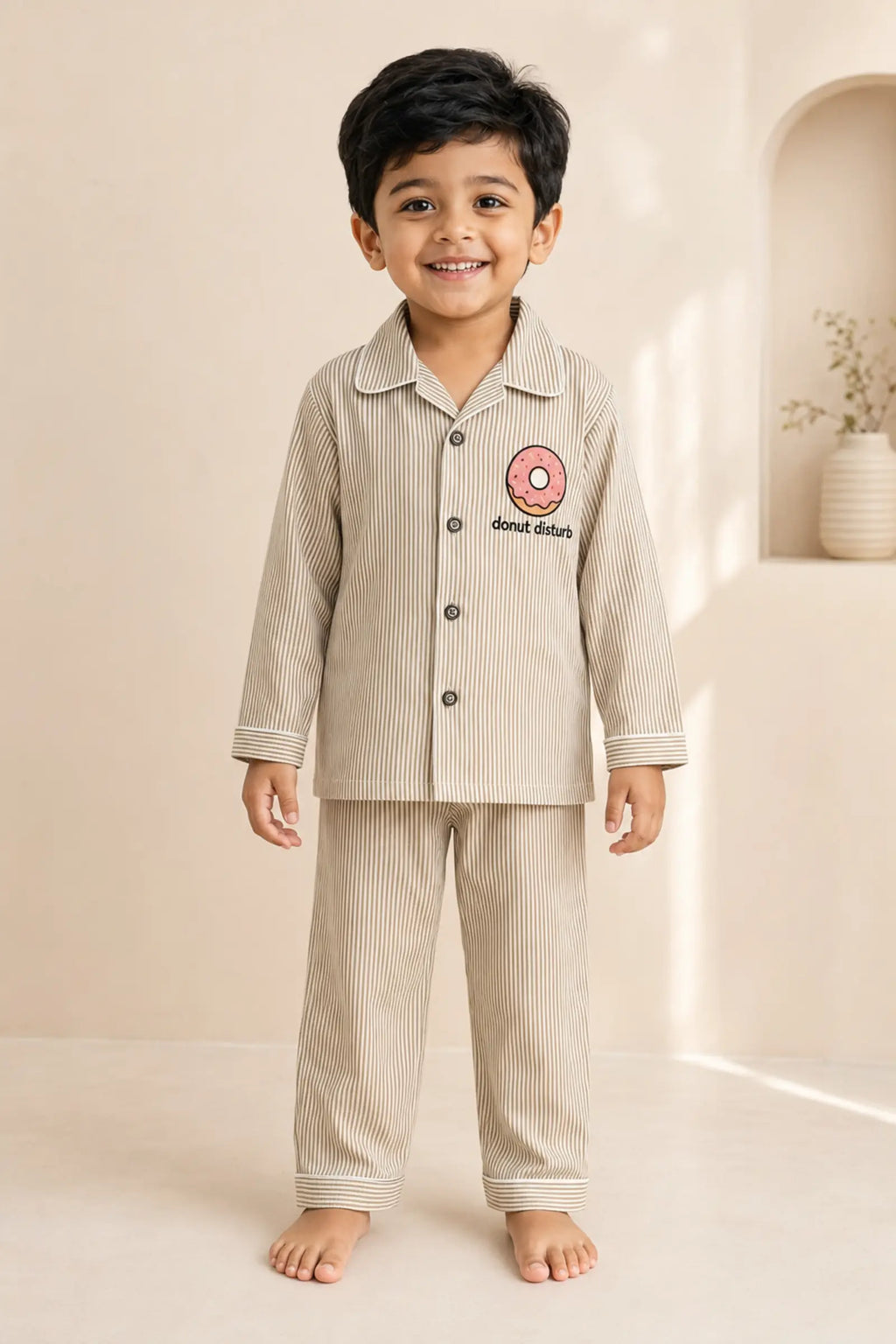 Boy wearing Donut Disturb striped kids night suit, front view