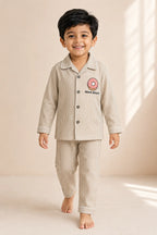 Boy wearing striped Donut Disturb night suit in three-quarter view