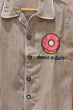 Close-up of the original striped Donut Disturb night suit