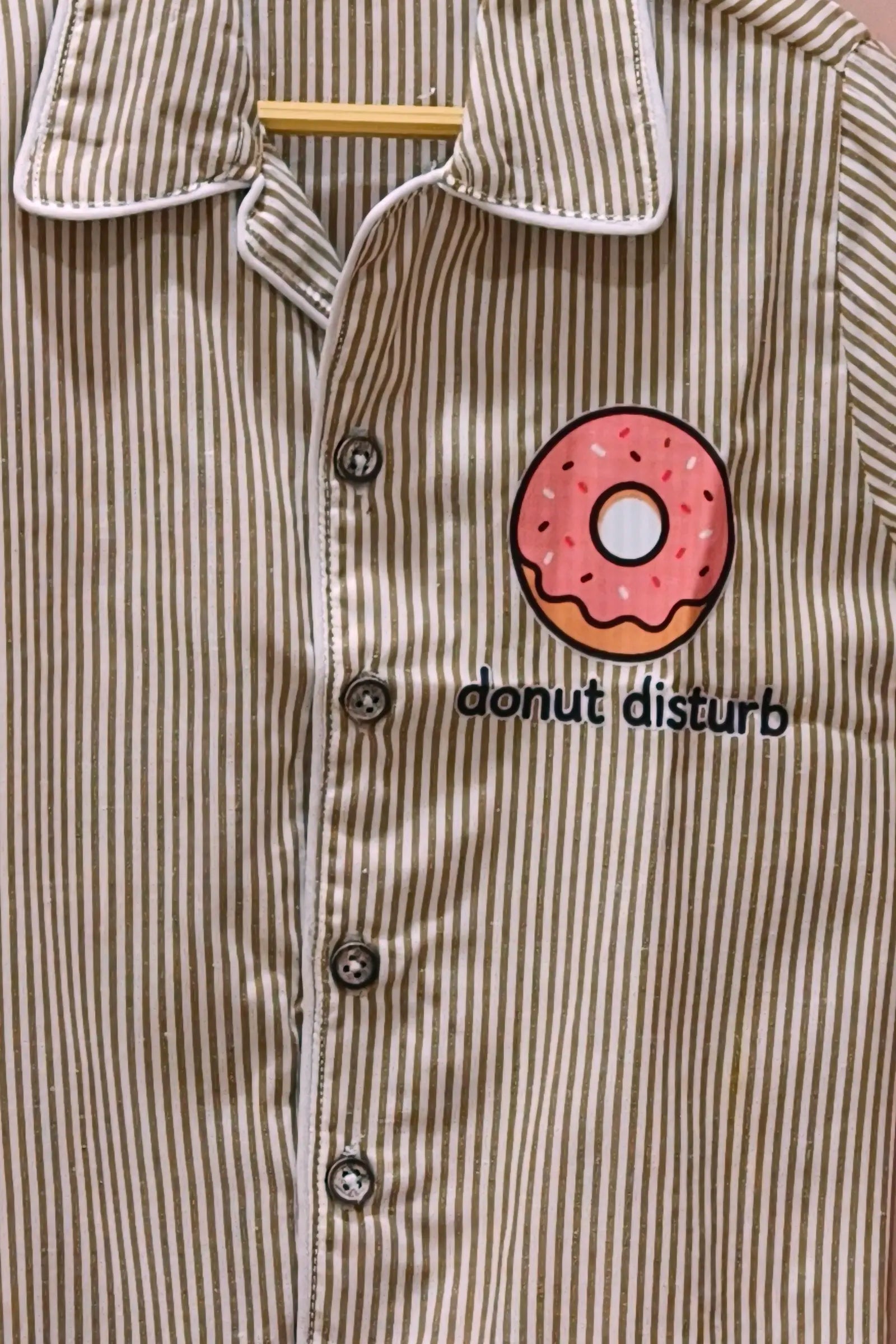 Close-up of the original striped Donut Disturb night suit
