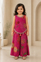 Girl wearing fuchsia pink floral short top and flared palazzo, front view