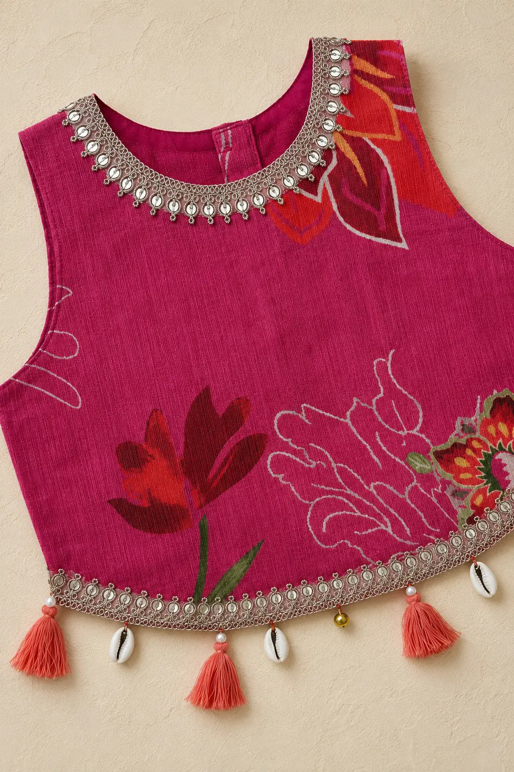 Close-up of floral top lacing and tassel details