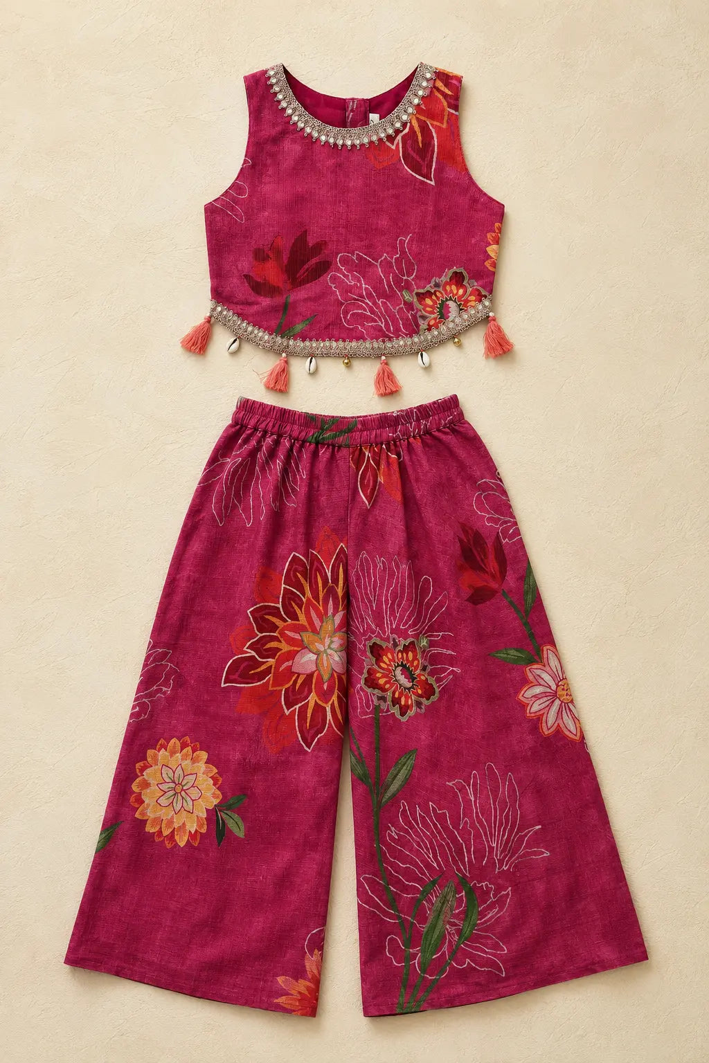 Fuchsia pink floral short top and flared palazzo laid flat