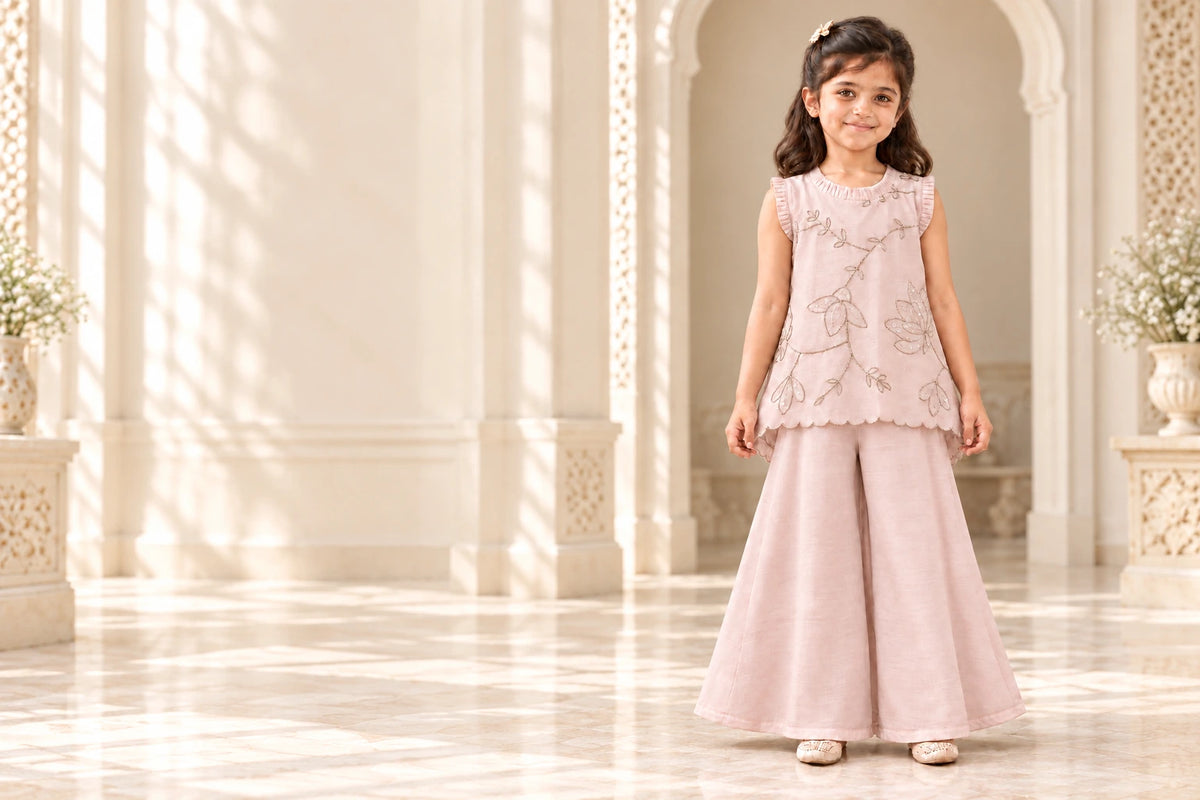 Girl wearing the nude pink mulmul pita work top and palazzo set
