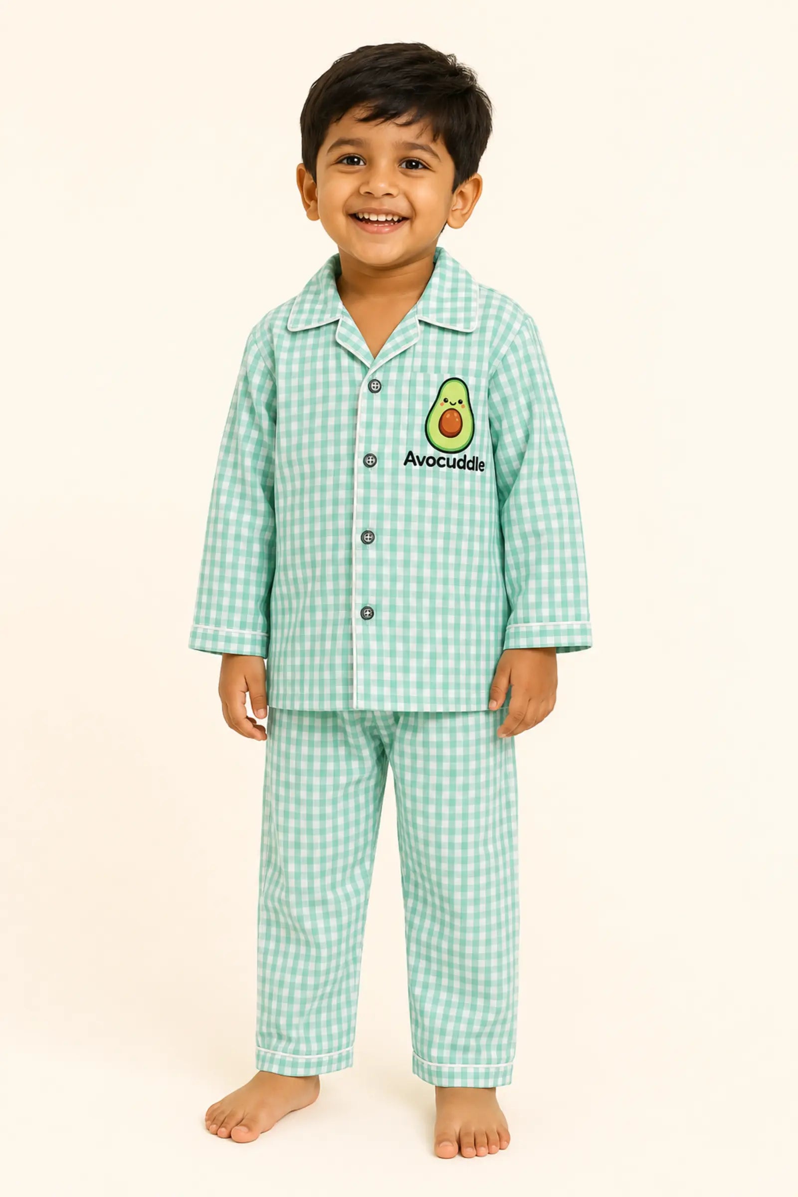 Boy wearing mint gingham Avocuddle kids night suit, front view