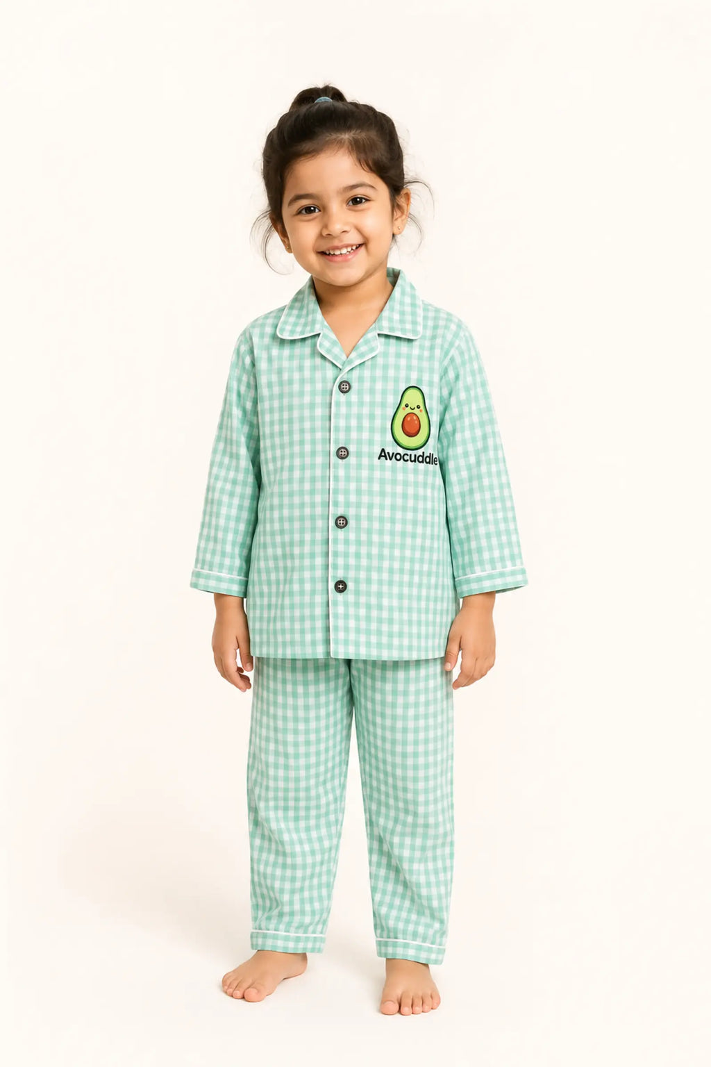 Girl wearing mint gingham Avocuddle kids night suit, front view