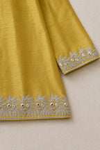 Close-up of gota work on the three-quarter sleeve cuff and kurta hem