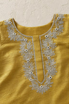 Close-up of mirror and gota handwork around the round neckline
