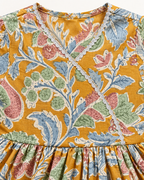 Mustard Floral Peplum Sharara Set for Girls — floral fabric and silver-toned trim close-up