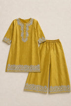 Mustard kurta and flared pants laid flat; dupatta not pictured