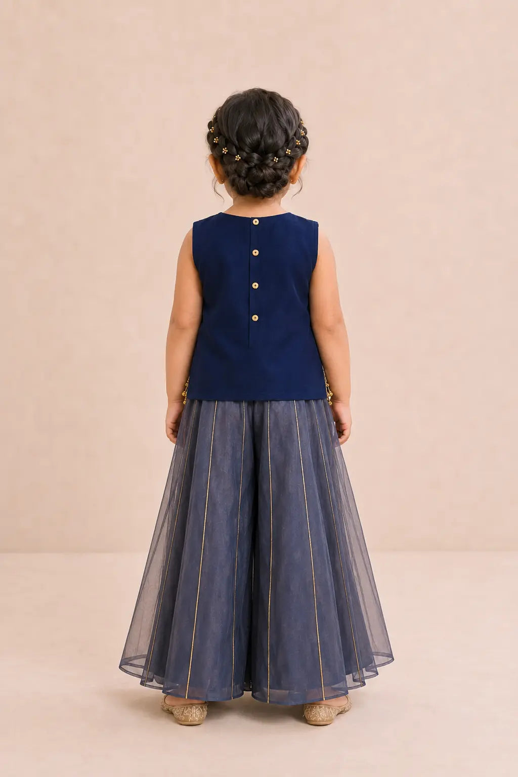 Back view of girl in navy blue top and dusty navy sharara