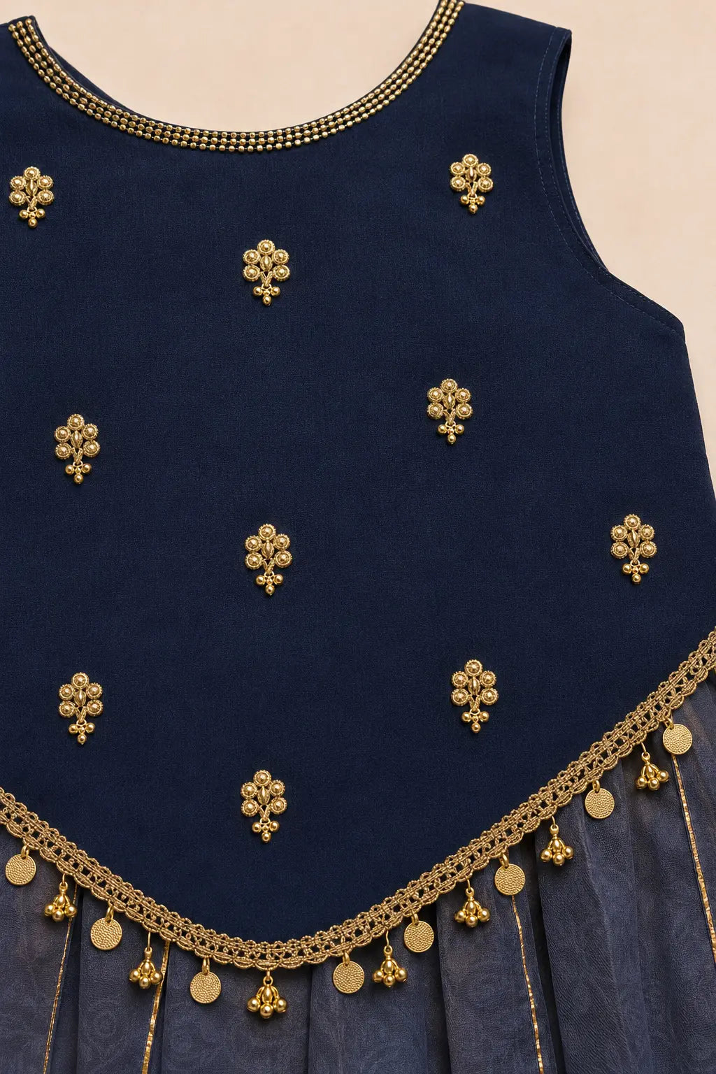 Close-up of zardosi butti, cutdana handwork and coin tassels on navy top