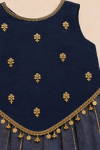 Close-up of zardosi butti, cutdana handwork and coin tassels on navy top
