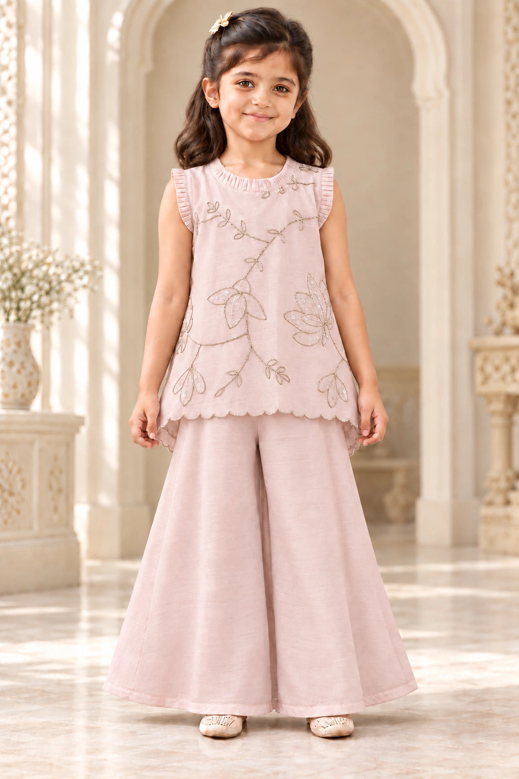 Girl wearing nude pink mulmul pita work top and palazzo set, front view