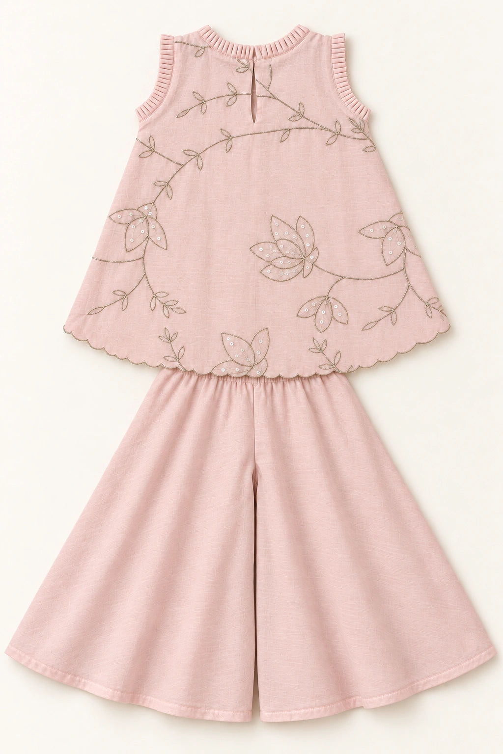 Back flat lay of nude pink mulmul top and matching plain palazzo trousers