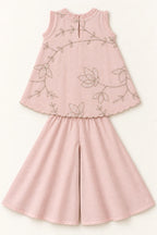 Back flat lay of nude pink mulmul top and matching plain palazzo trousers