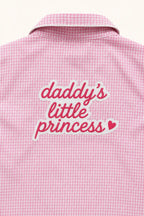 Close-up of Daddy's Little Princess print on pink gingham shirt