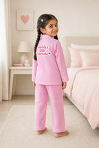 Girl wearing pink gingham night suit, back view with Daddy's Little Princess print