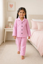Girl walking in bubblegum pink gingham night suit