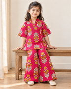 Rani Pink Floral Angrakha Palazzo Set for Girls — seated lifestyle view