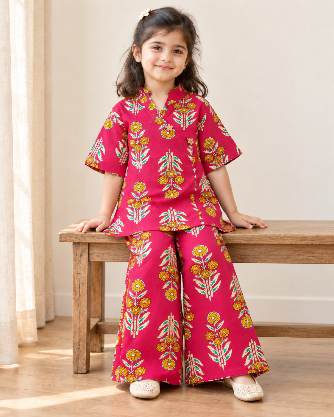 Rani Pink Floral Angrakha Palazzo Set for Girls — seated lifestyle view