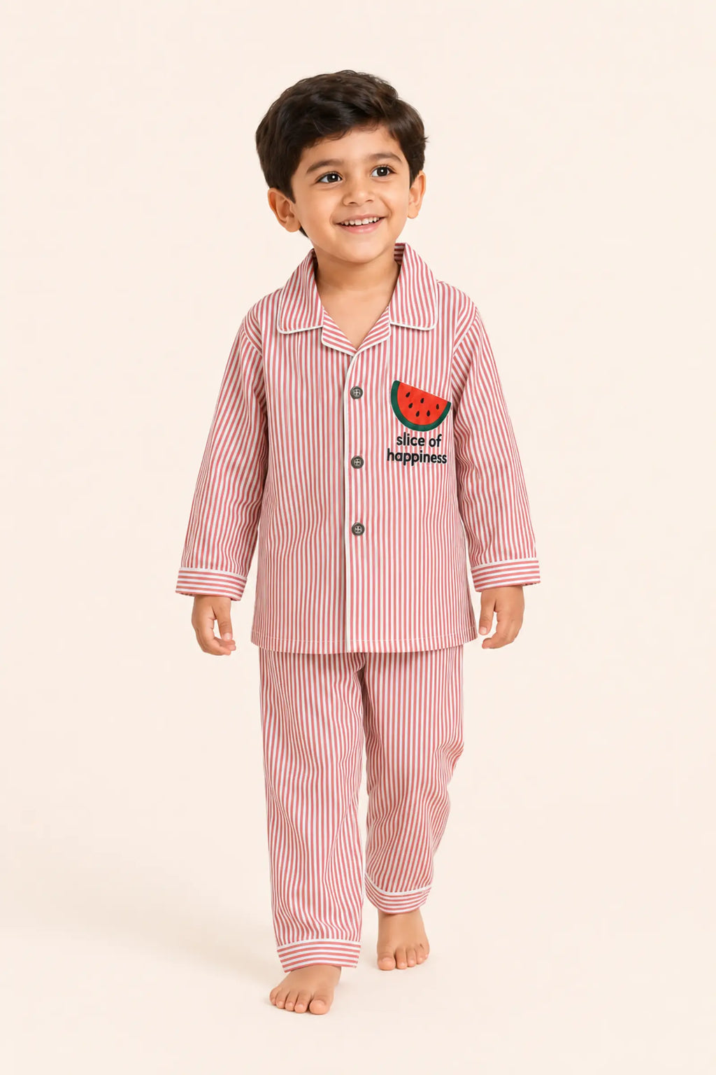 Child walking in red striped Watermelon night suit
