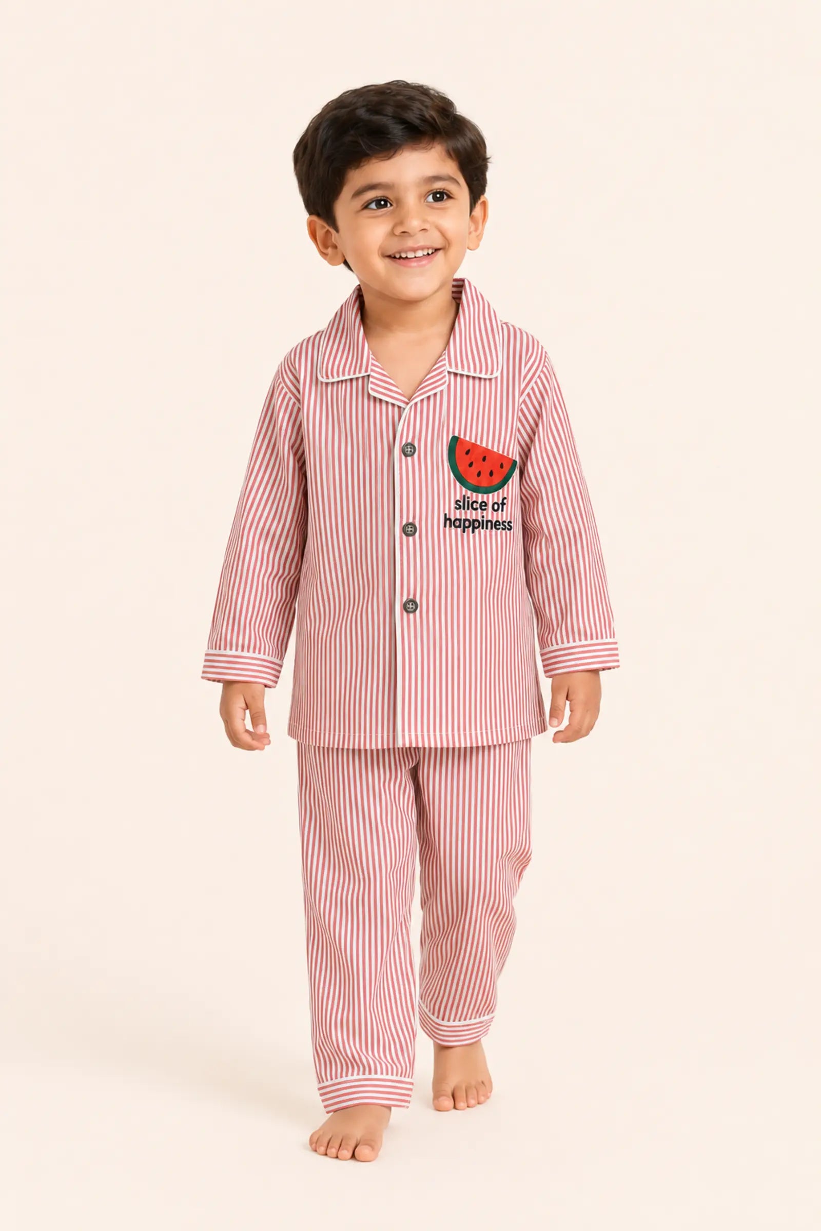 Child walking in red striped Watermelon night suit