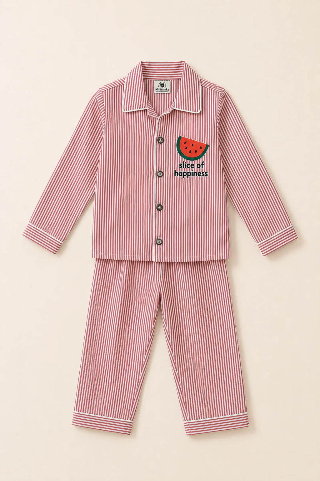 Close-up of watermelon artwork, buttons and striped fabric