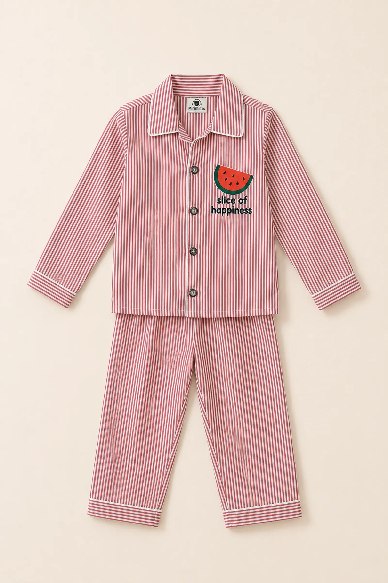 Close-up of watermelon artwork, buttons and striped fabric