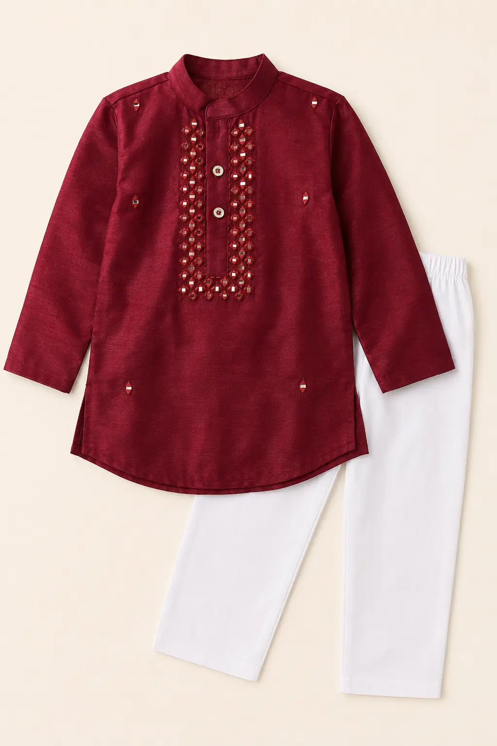 Ruby red candy silk kurta and classic white pants laid flat