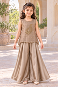 Girl wearing a taupe gold tissue-organza handwork top and satin palazzo trousers, front view